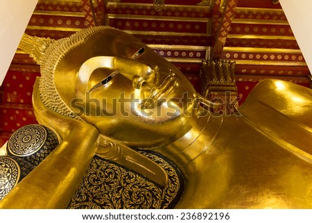 Reclining Buddha gold statue face Thailand Ang Thong