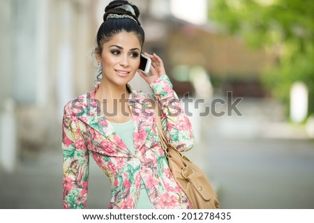 Beautiful Smiling WomanTalking On Mobile Phone, Business woman with phone at street. summer. series