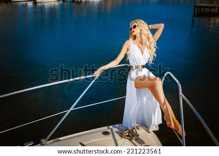 Glamour sexy woman vogue style model on yacht luxury lifestyle, fashionable tanned woman portrait sea vacation, Sensual blonde beautiful woman, Girl with perfect body and long healthy hair,
