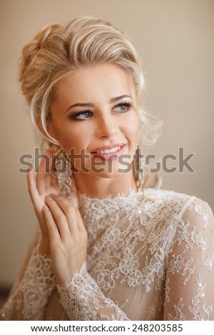 Beautiful Bride Portrait wedding makeup, wedding hairstyle, Wedding dress. Wedding decoration. soft selective focus. gorgeous young bride at home. series.