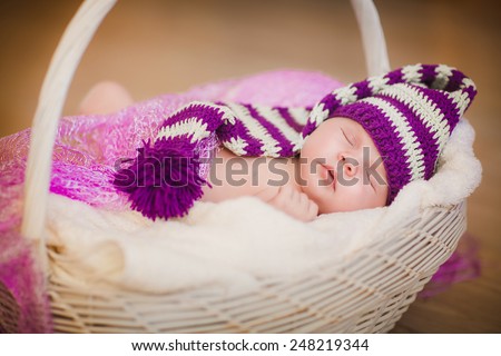 New born baby sleeping curled up on blanket, Newborn baby girl peacefully sleep, little baby slipping, cute 1 months baby lying down on blanket. soft selected focus, series