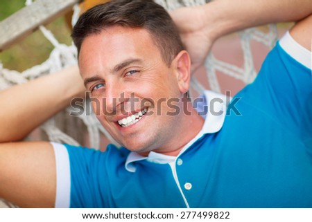 Handsome young man smiling outdoor, closeup male portrait in casual top, man healthy life style, hipster man face, happy man vacation on nature, series.