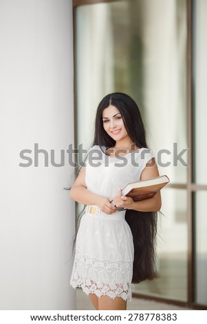 Female student outdoors campus college student young woman reading book girl with book, happy woman smiling, series