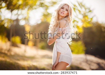 Beautiful woman outdoors portrait natural beauty girl face blonde female skin care. Portrait of beautiful blonde lady at sunset series. soft light.