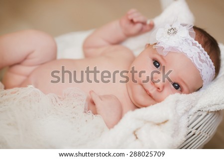 Baby newborn child sleep in basket cute little girl new born baby smiling, portrait of 1 month baby girl, adorable kid in cozy accessories at home, soft focus, mother care concept, series