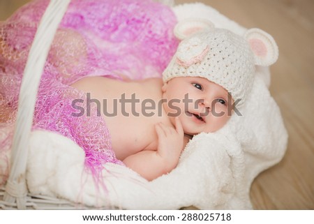 Baby newborn child sleep in basket cute little girl new born baby smiling, portrait of 1 month baby girl, adorable kid in cozy accessories at home, soft focus, mother care concept, series