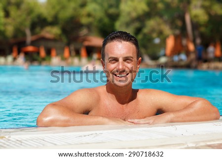 Handsome man at beach pool, sexy male model fit man posing in swimming pool, male model in swimwear at summer vacation, attractive man model outdoor portrait, Man sunbathing on the beach, series
