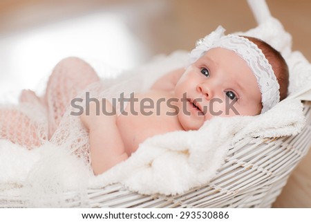Cute newborn baby girl 1 month child sleeping in basket, adorable little girl new born kid portrait, happy baby portrait, beautiful little girl , soft tonality, series