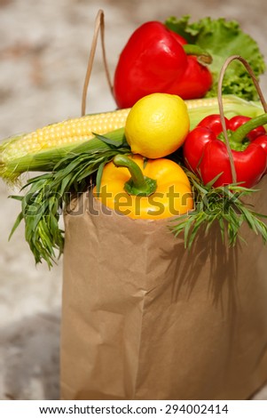 Assortment of vegetables organic food, fresh raw vegetables in bag grocery shop, shopping bags full of vegetables, harvest concept, organic corn, pepper,green salad, healthy eating, selective focus