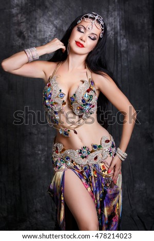 Gorgeous Arabian Bellydancer Sexy Woman In Bellydance Colorful Costume Over Black Background Sensual Arabic Girl Gorgeous Arabian Bellydancer Sexy Woman In Bellydance Colorful Costume Over Black Background Sensual Arabic Girl
