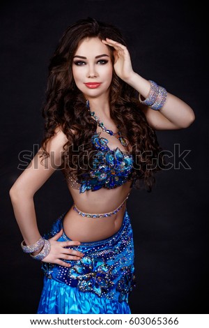 Dancing Arabian Woman Sexy Bellydancer In Blue Silk Dress Studio Isolated Sensual Turkish Girl Belly Dancing Arabian Woman Sexy Bellydancer In Blue Silk Dress Studio Isolated Sensual Turkish Girl Belly