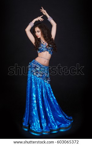 Dancing Arabian Woman Sexy Bellydancer In Blue Silk Dress Studio Isolated Sensual Turkish Girl Belly Dancer Perfect Sexy Body And Bright Makeup Arabic Dancing Arabian Woman Sexy Bellydancer In Blue Silk Dress Studio Isolated Sensual Turkish Girl Belly Dancer Perfect Sexy Body And Bright Makeup Arabic