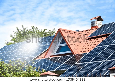 solar panels, Close up shot of a solar panel array with blue sky, Solar panels on a roof for electric power generation, Solar panel on a red roof reflecting the sun