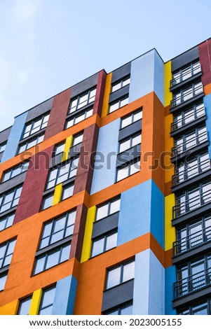 Similar – Image, Stock Photo Facade of modern multicolored building with narrow windows