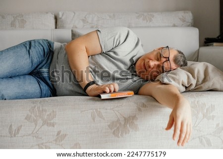 Similar – Image, Stock Photo Man with glasses sleeps and rests