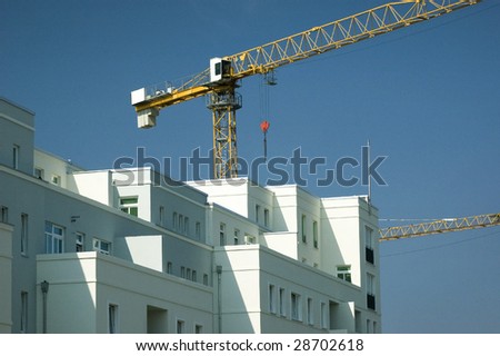 Apartment building with a crane in the background