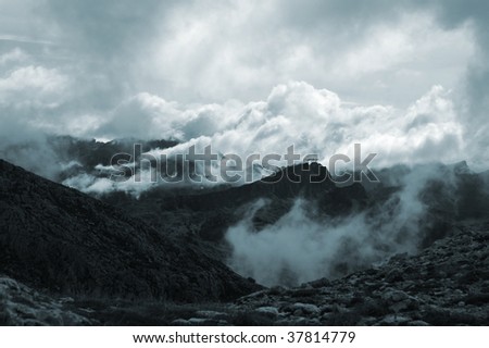 dramatic clouds in the mountains