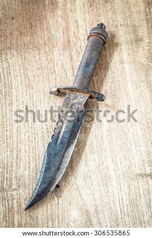 old knife on wooden