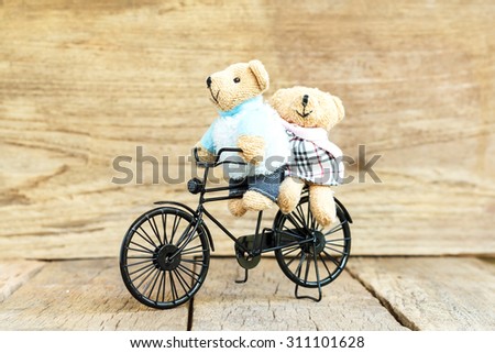 Teddy Bear toy Riding a Vintage Toy bicycle