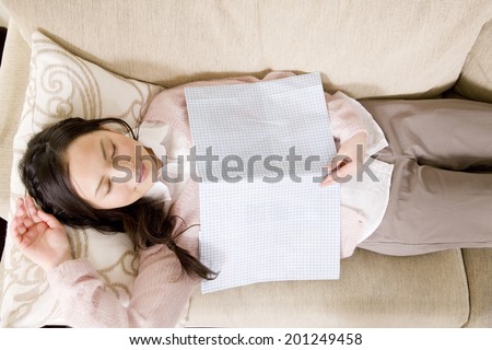 A woman sleeping on a couch