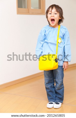 Kindergartener laughing from ear to ear