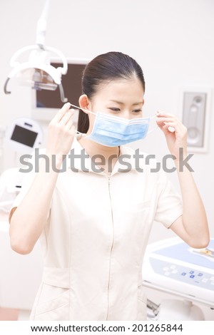 Dental hygienist wearing a mask