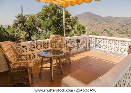 Image of a small Spanish patio in the afternoon sun.