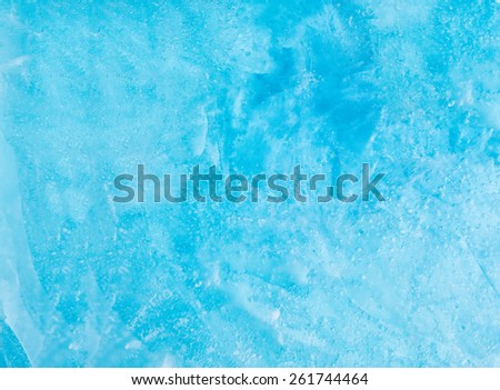 Winter blue ice texture background made of frozen ice