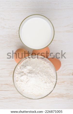 flour, milk, eggs, baking ingredients on the table
