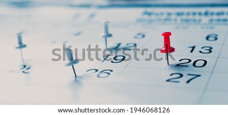 Calendar page pinned in a calender on datebusiness meeting schedule, travel planning or project milestone and reminder concept.