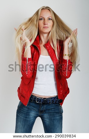 Fashion model poses against a plain background