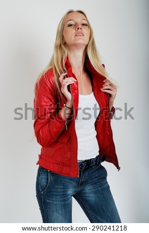 Fashion model poses against a plain background