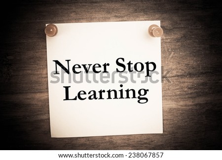 Text never stop learning on note paper