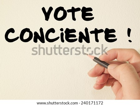 vote conciente  (Portuguese: Vote Consciente)  text write on wall