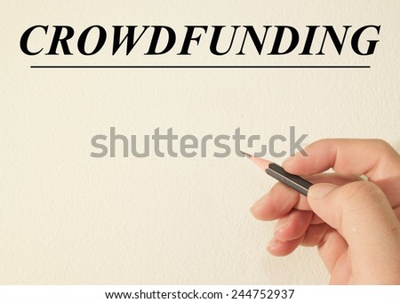 crowd funding text concept write on wall paper