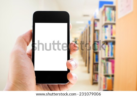Close up hand  holding smart phone with blank screen on library background