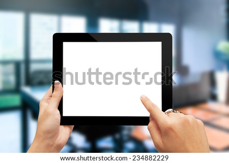 male teen hands with ring using tablet pc on office background