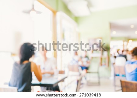 blurred background of talking people in restaurant