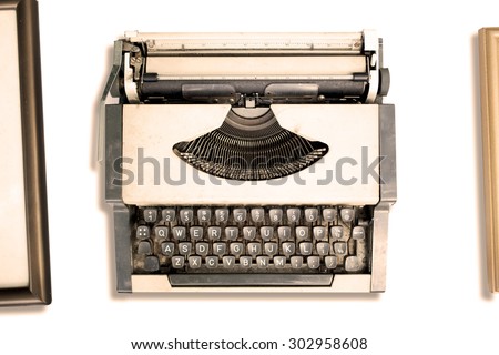 Top view of vintage typewriter with old frame on white background. retro style