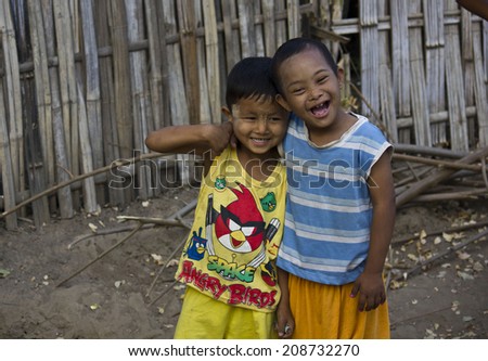 Bagan, Myanmar, March 2, 2014: In a little village, two children plays together. One of them has the down syndrome.  I don t see any difference   It s not diversity, it s friendship