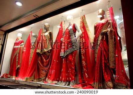 DELHI, INDIA - DEC 1: Beautiful dress for women in a shop in New delhi, colorful red and with sparkling beads on December 1 2012