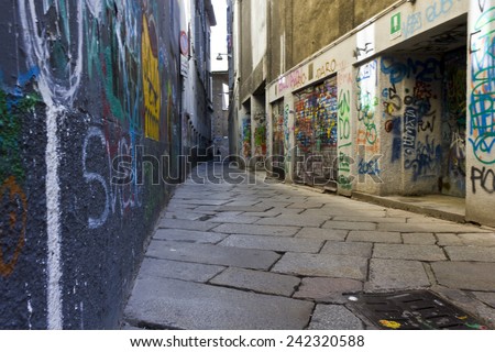 MILAN, ITALY - MAY 9: Via Bagnera, a narrow street in the heart of the city of Milan, characterized by murals throughout the wall, on May 9 2014
