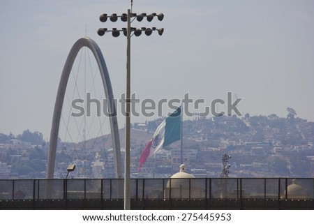 SAN DIEGO, USA - AUGUST 20 2013: Boundary line between United States and Mexico, from San Diego looking at Tijuana Revolucion Arch