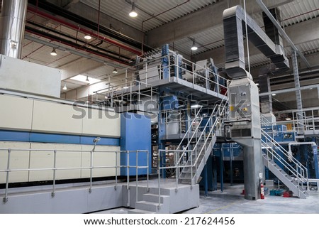 ZAGREB, CROATIA - SEPTEMBER 16, 2014: View of huge Koenig Bauer machine in Printing house. Koenig Bauer is one of the largest manufacturers of printing machines