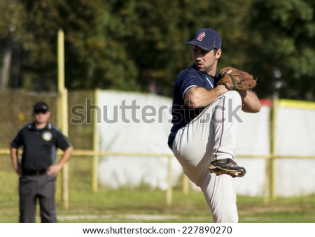 ZAGREB. CROATIA - OCTOBER 12, 2014: Baseball match Baseball Club Zagreb in blue jersey and Baseball Club Olimpija in dark blue jersey. Unidentified baseball pitcher in throwing position