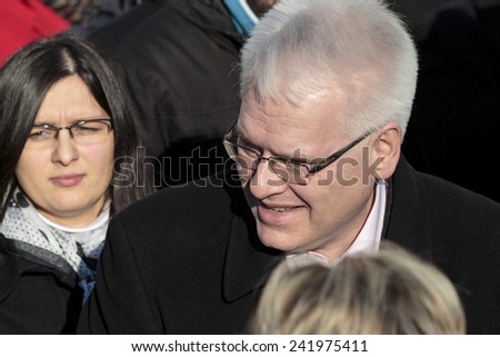 SAMOBOR, CROATIA - JANUARY 04, 2015: Ivo Josipovic the third President of Croatia on the promotion for the next presidential election in Croatia. The President is interacting with people.