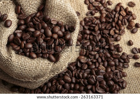 Arabica coffee in jute bag close up