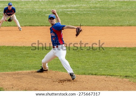 ZAGREB, CROATIA - MAY 03, 2015: Baseball match Baseball Club Zagreb in blue jersey and Baseball Club Pirates in white jersey. Baseball pitcher is throwing the ball