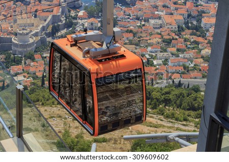 DUBROVNIK, CROATIA - AUGUST 13, 2015: Tourists at Cable car which connects Dubrovnik and mountain Srdj above town.