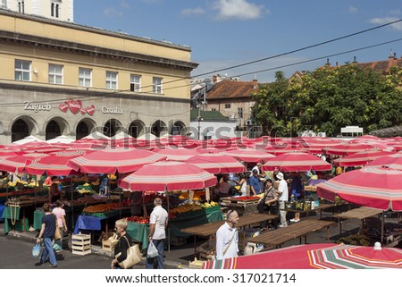 ZAGREB, CROATIA - AUGUST 26, 2015: Customers and sellers at Dolac, the famous open air farmer\'s market of agricultural products in Zagreb, one of city\'s most notable landmarks.